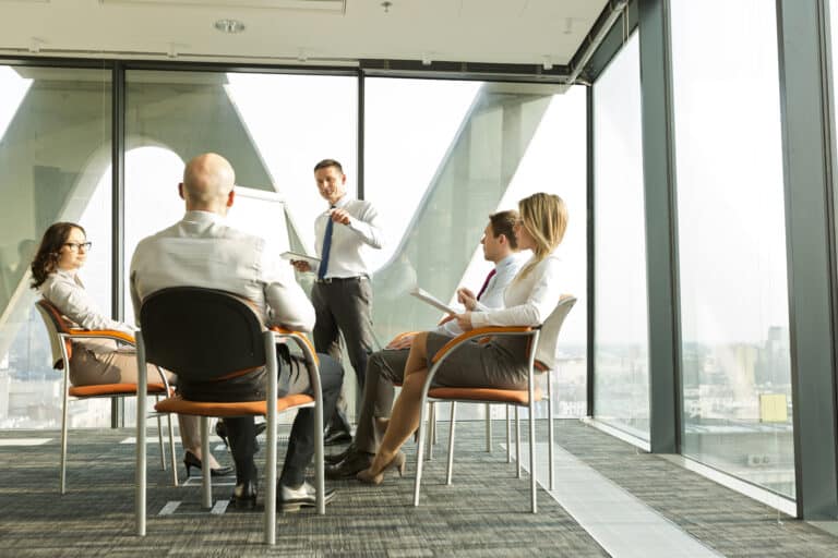 Group of businesspeople attending a business meeting in an office setting