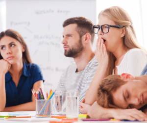 Bored participants in a meeting exhibit disinterest and fatigue during discussions.