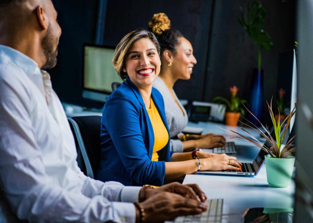 Three colleagues working in an office.