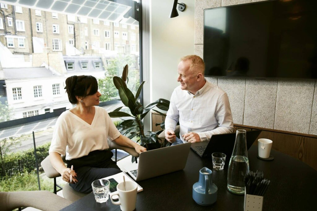 Business meeting in modern office setting.