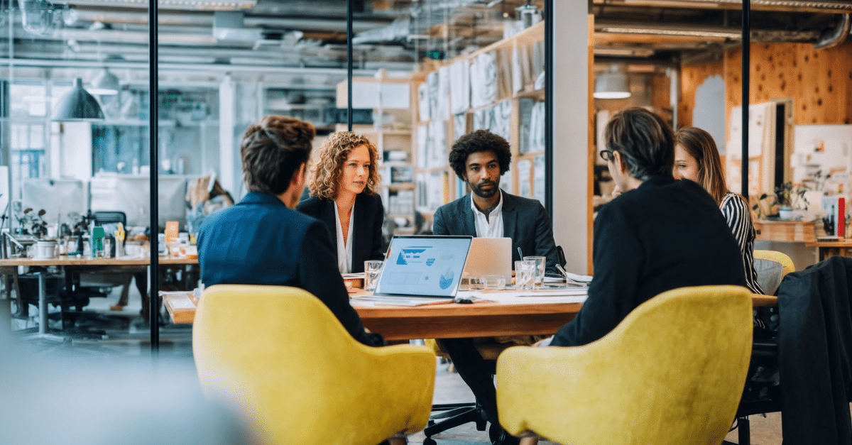 Business meeting in modern office setting.